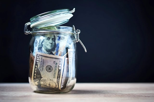 7 Best High-Dividend ETFs for Income-Hungry Investors 9 money jar financial minimalism frugal saving