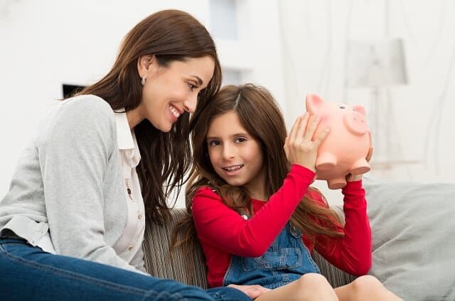 Chase First Banking Review: Bank Account & Debit Card for Kids 7 mother and daughter piggy bank smiling