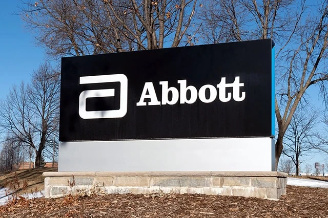 The 10 Best-Rated Dividend Aristocrats Right Now 6 an abbott laboratories sign with a black background.