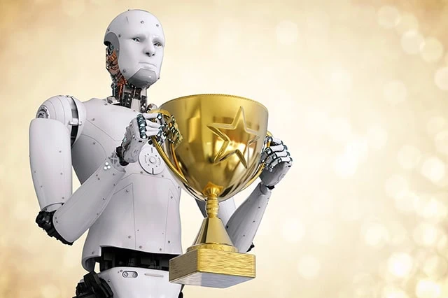 a humanoid robot holding a gold trophy.