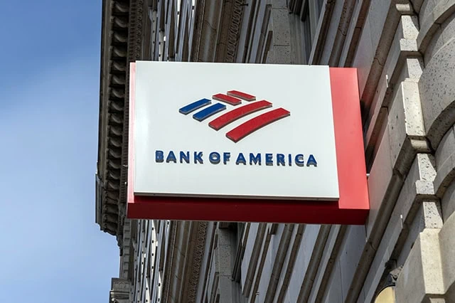 The Best Dividend Stocks: 10 Pro-Grade Income Picks for 2025 12 a small bank of america sign juts out of a city building.