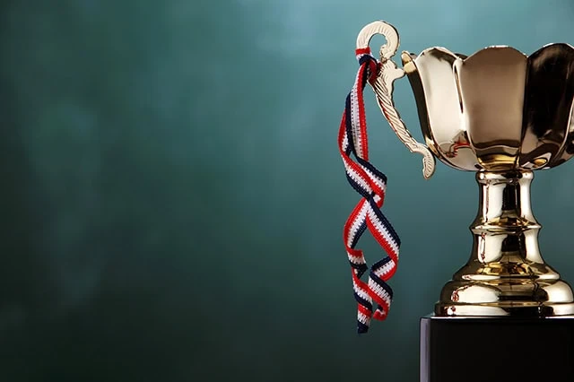 8 Best-in-Class Bond Funds to Buy 4 a gold trophy with ribbons hanging off it.