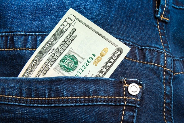 11 Best Vanguard Funds for the Everyday Investor 14 cash money dollar bills pocket