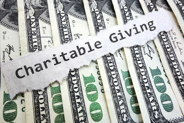 How Can I Lower My Taxes in Retirement? 8 Proven Strategies 7 charity charitable giving dollar bills donation