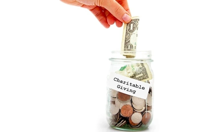 RMDs for Roth 401(k) Accounts No Longer Required 9 charity charitable giving dollar coins jar