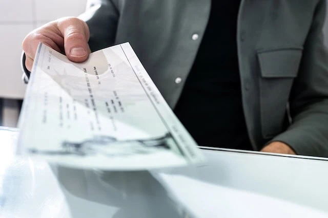 Social Security Timing: 7 Questions to Pinpoint Your Perfect Starting Age 2 collect social security retirement check 640