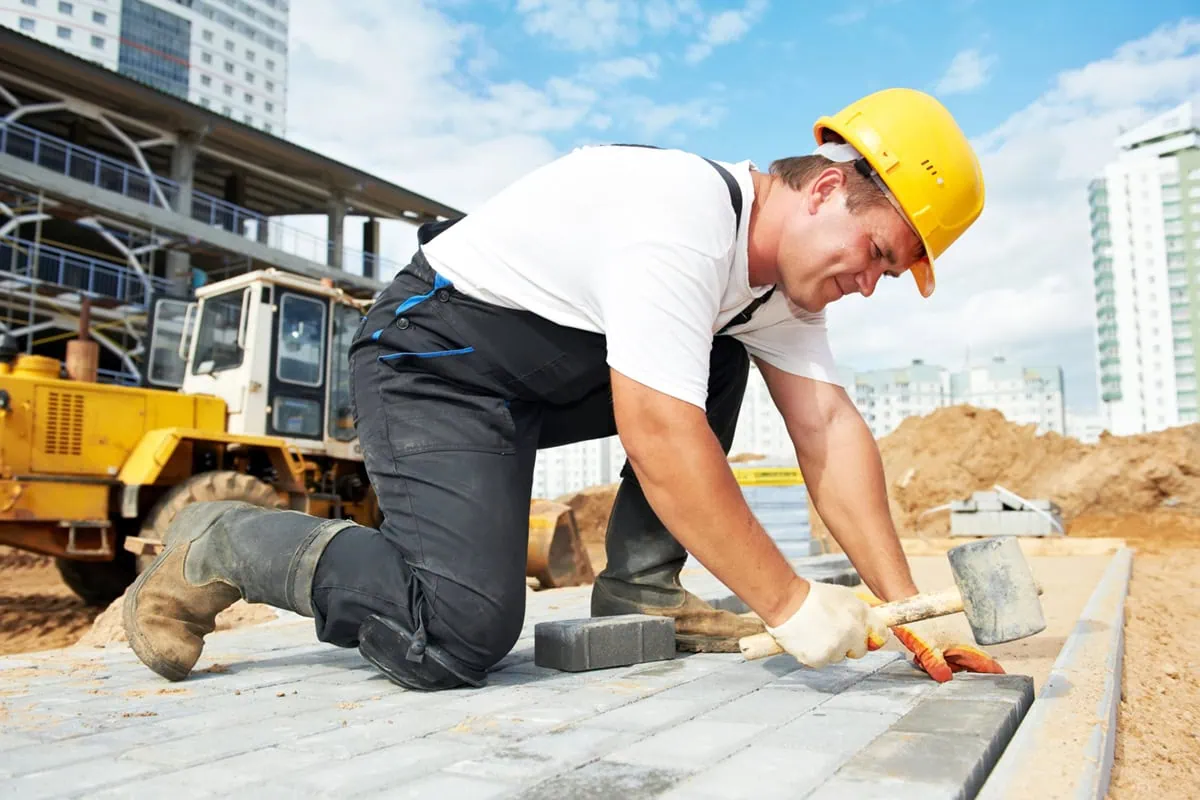 a construction worker labors on site.