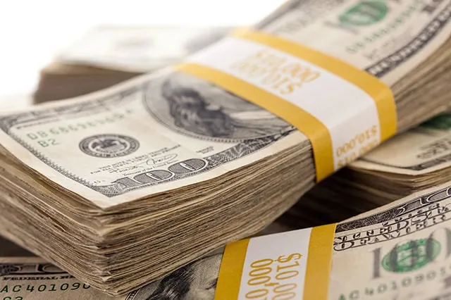 stacks of hundred-dollar bills.