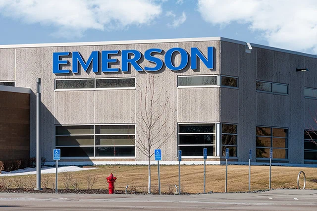 The 10 Best-Rated Dividend Aristocrats Right Now 9 Emerson Electic manufacturing facility and trademark logo.