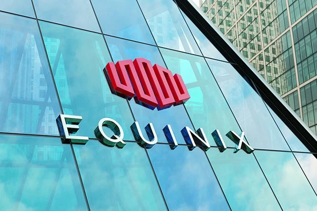 The Best REITs You Can Buy in 2025 2 equinix logo on the side of a blue glass building.