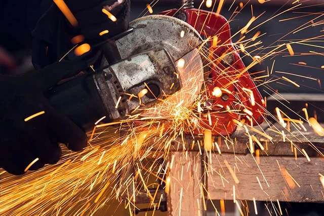 14 Dividend Kings for Royally Resilient Income 6 a circular saw makes sparks while working.