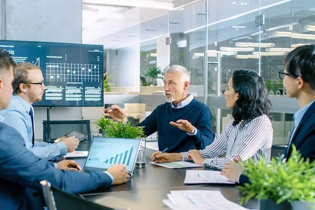 Where to Keep Your Money Other Than a Traditional Bank 5 investor-executive-meeting-office-graph