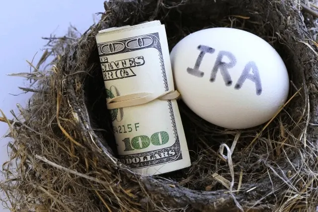 Are You Saving Enough for Retirement? 10 ira nest egg with roll of cash money