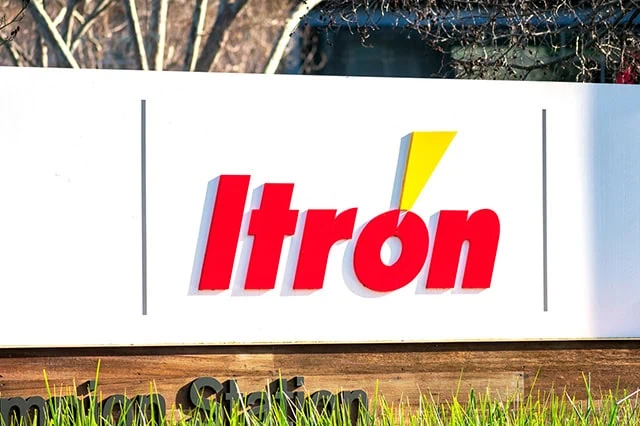 an itron sign in front of an office building.