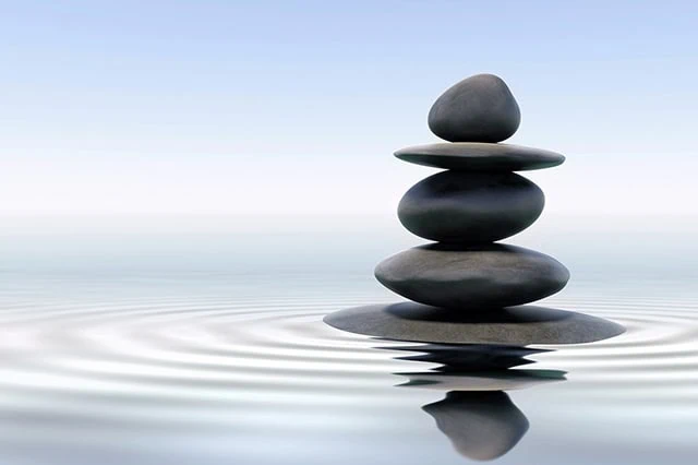 Seniors Can Save More With These 10 Discounted Memberships + Subscriptions 13 rocks balanced on water.