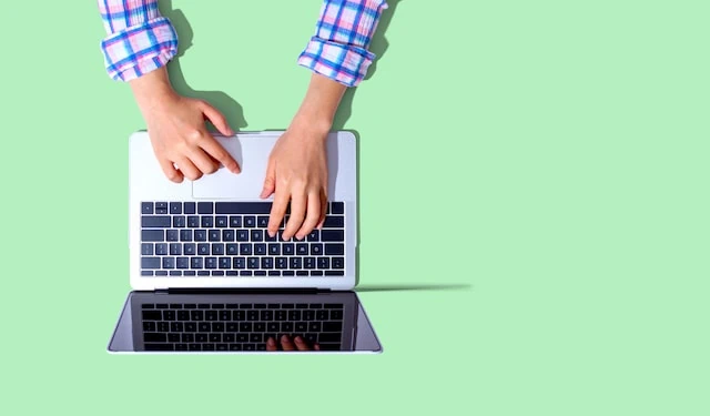 60 Personal Finance Statistics You Might Not Know (But Should!) 2 Person using a laptop computer