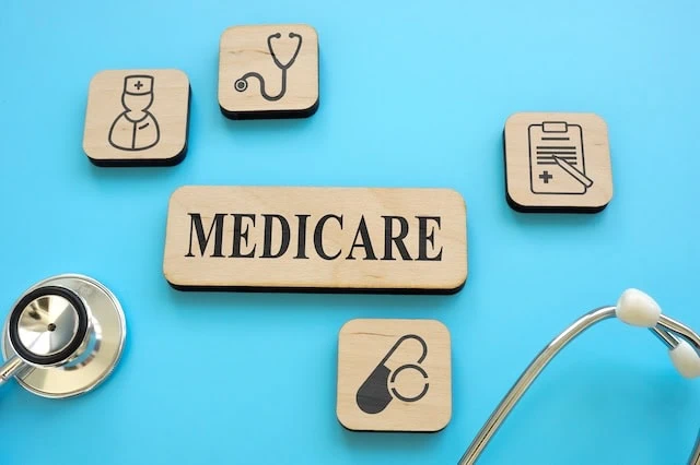 Elderly Scams: Beware These 15 Schemes Targeting Seniors 2 medicare coverage wooden blocks