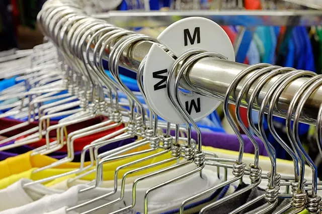 9 Best Schwab Funds You Can Buy: Low Fees, Low Minimums 5 medium label on a clothes rack.