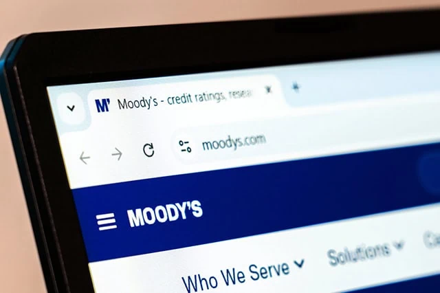 picture of moodys website on a laptop screen.