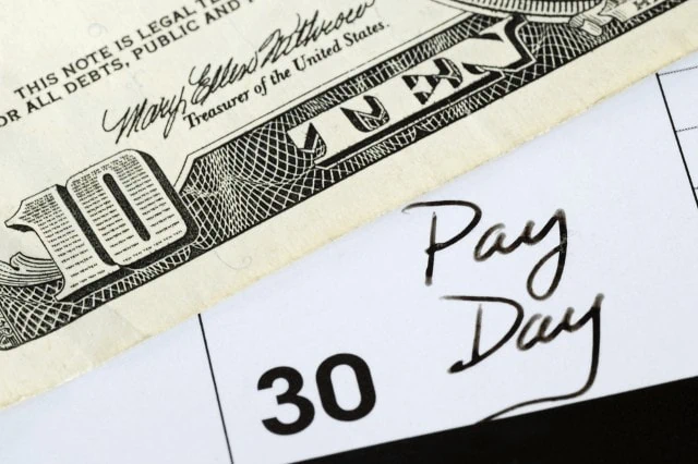 10 Monthly Dividend Stocks for Frequent, Regular Income 6 pay day on calendar with money