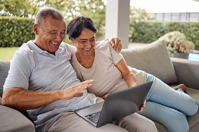 retirement investing happy couple gray laptop 640