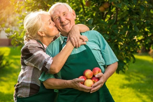 Are RMDs Required If You're Still Working? 7 senior spouse apple picking retirement strategy 640