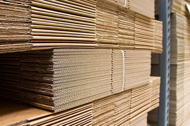 several stacks of folded cardboard boxes.