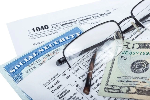 Don't Believe These 17 Social Security Myths 14 tax form social security card money glasses