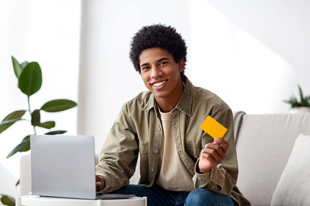 Best Debit Cards for Rewards + Cash Back 16 teen with debit credit card laptop