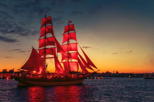 a ship with red sails similar to the vanguard logo.