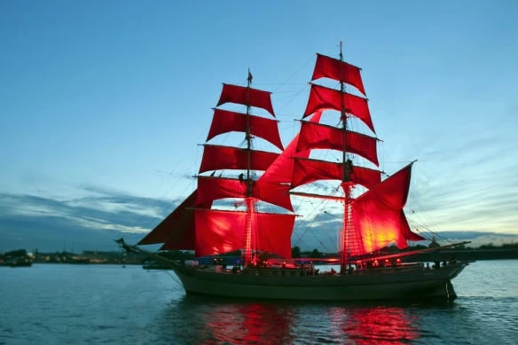 a ship with red sails similar to the vanguard logo.