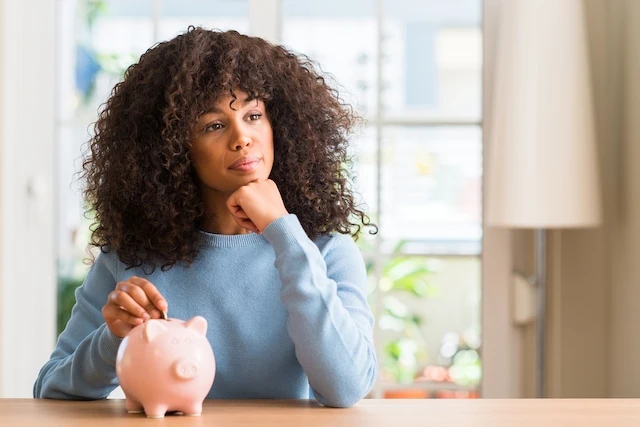 Frugal vs. Cheap: What's the Difference? 3 woman putting money in a piggy bank thinking
